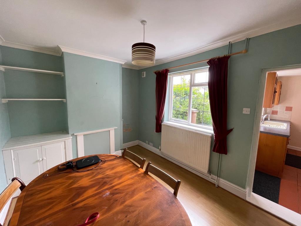 Lot: 20 - THREE-BEDROOM COTTAGE FOR IMPROVEMENT - Dining Room with access to Kitchen and window to rear