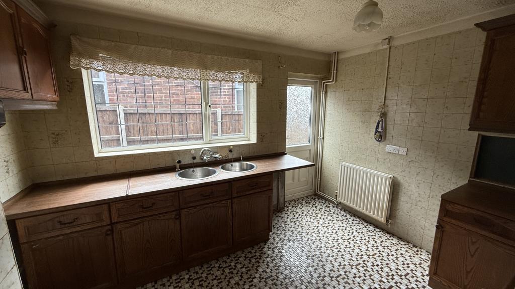 Lot: 136 - DETACHED BUNGALOW WITH GARAGE - Interior image of kitchen from hallway