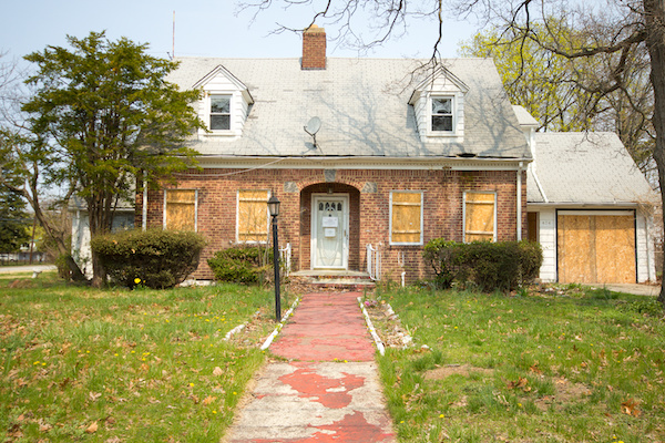 A property with boarded-up windows did not sell at auction