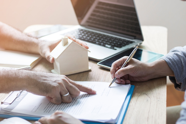 A buyer and a solicitor working together on the exchange of contracts
